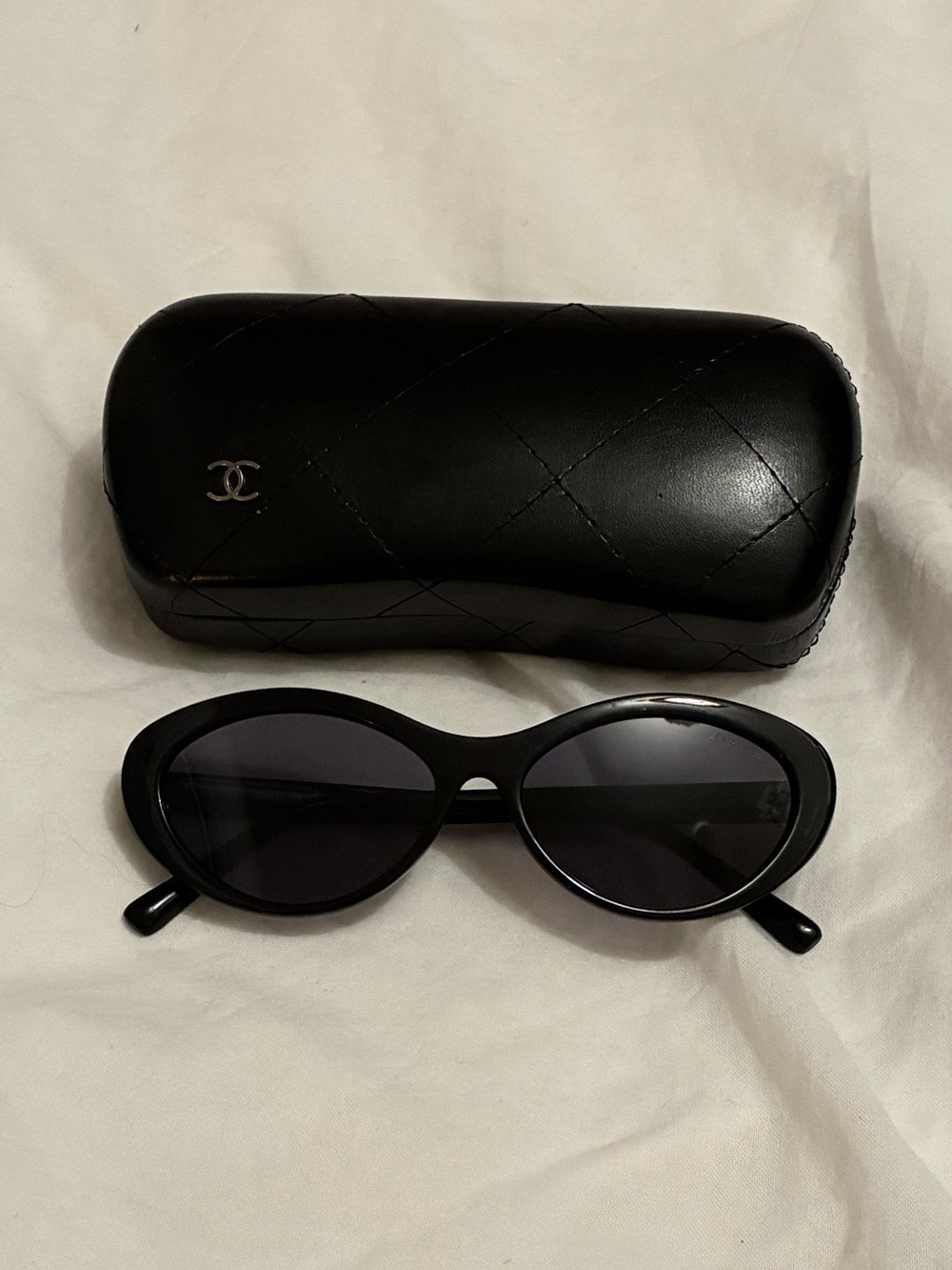 CHANEL Black Oval Sunglasses with Quilted Case